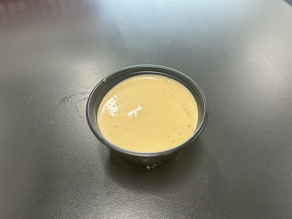 Danny's Burger Shack Sauce, creamy a bit tangy. Complements the tots and the onion rings well.