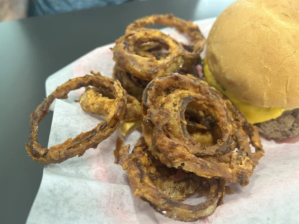 Onion Rings, A sad flavorless burnt disappointment.