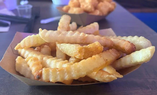 Fries. Crinkle cut. Crunchy and seasoned well.